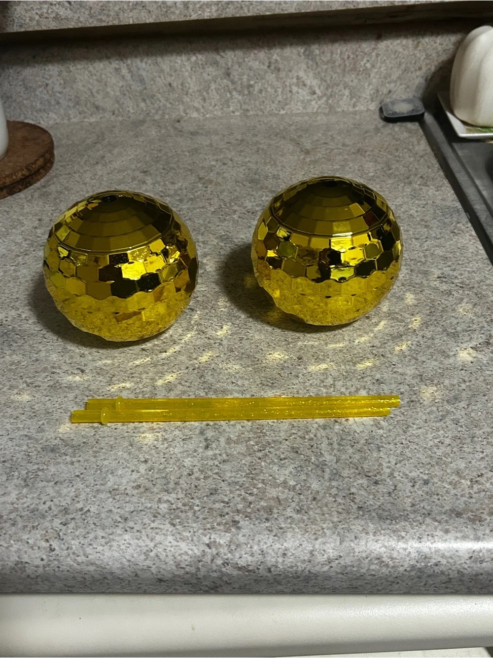 A set of 2 gold disco cups